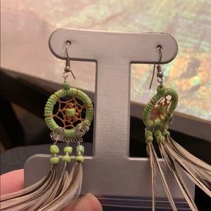 Green dream catcher and feather earrings.